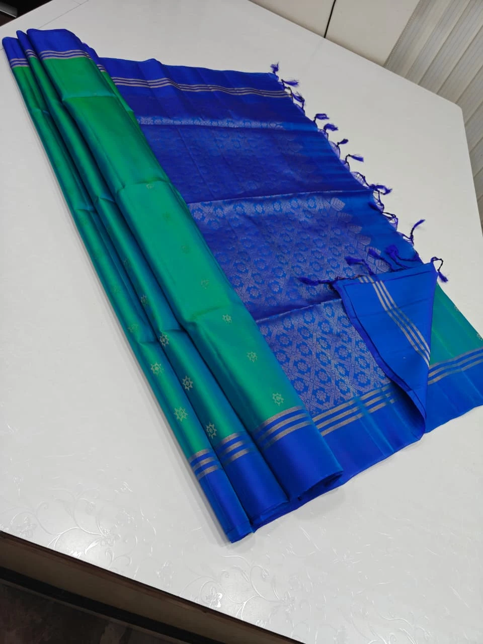 Green Teal with Royal Blue Star Flower Buttas and Silver Stripe Border Soft Silk Saree